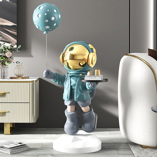 Balloon serving astronaut sculpture — turquoise space butler decor with tray