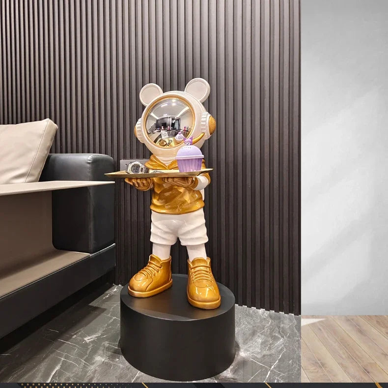 Large astronaut sculpture — gold and white luxury space decor figurine on pedestal